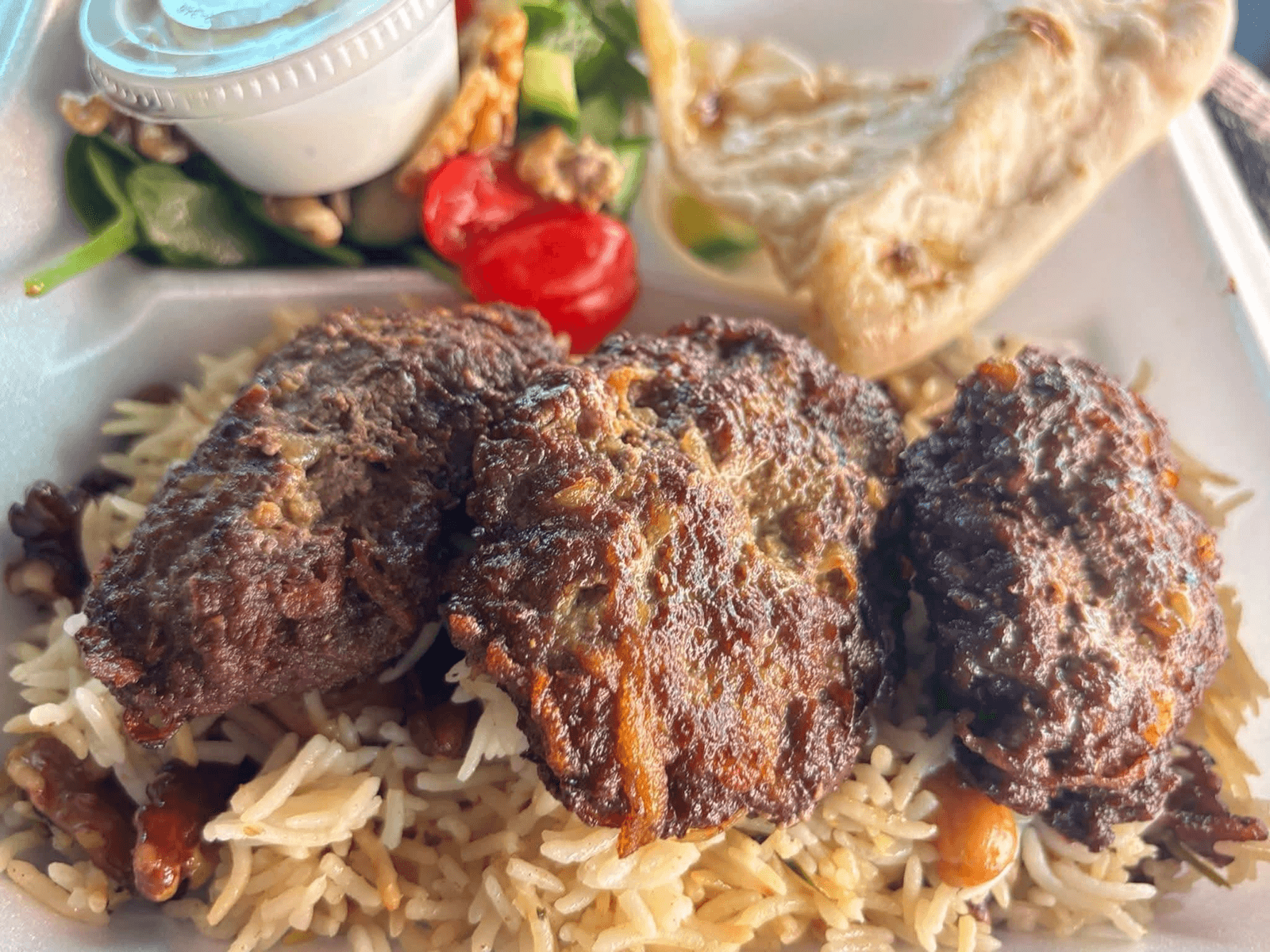 Chapli Kabobs with rice and salad